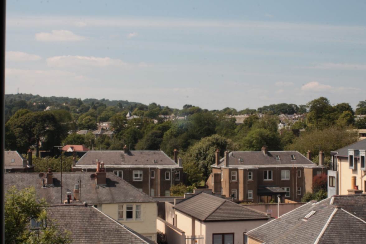 A picture containing outdoor, sky, house, town